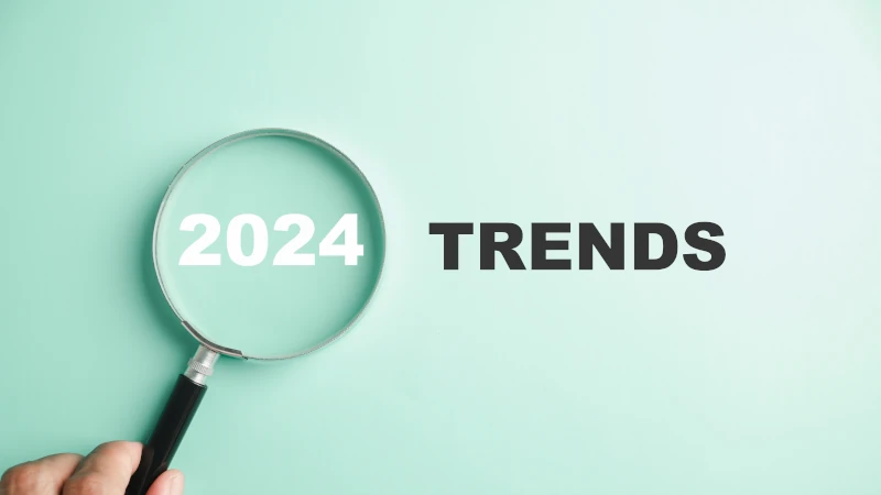 Les mots 2024 et trends sont écrits et une loupe zoom sur 2024